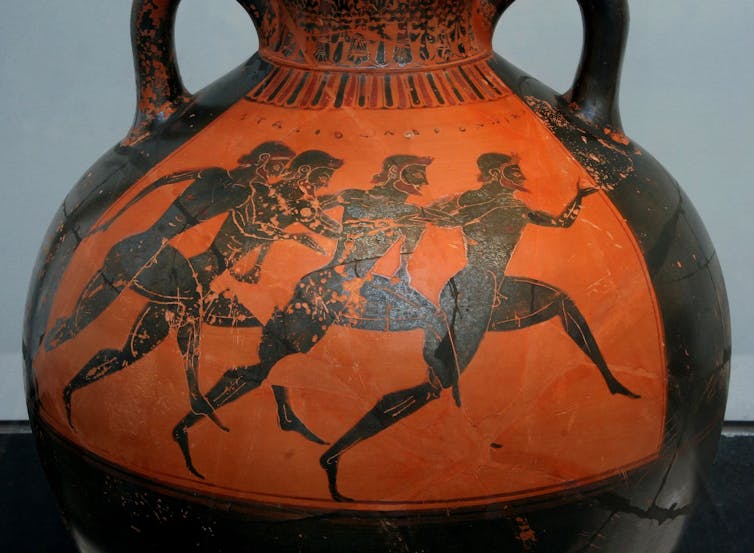 Greek vase depicting runners at the Panathenaic Games c. 530 BC. Vase is terracotta and the runners are black.