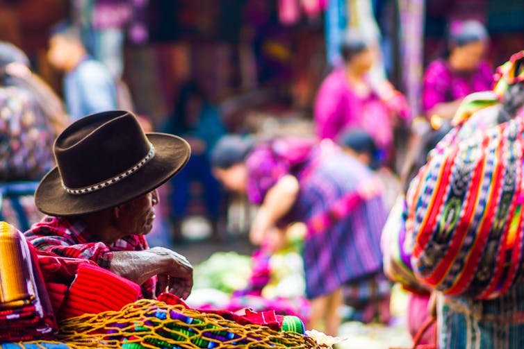 Man in colourful market