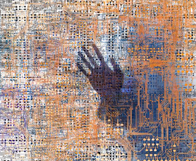 The outline of a human hand trapped behind a grid of tiny intersecting circuits.