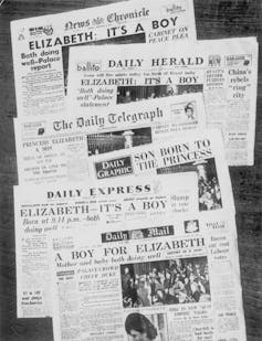 A line of newspapers showing headlines on a baby boy born to Queen Elizabeth