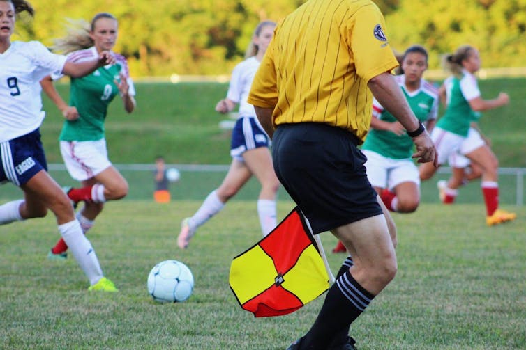 Female soccer players playing match