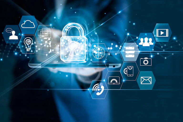 Hand holding tablet with transparent icons above such as a padlock, cloud, people, telephone.