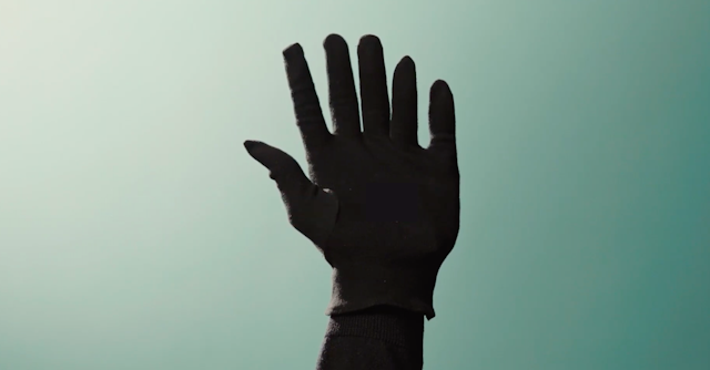 The picture of a glove containing a sixth, robotic finger