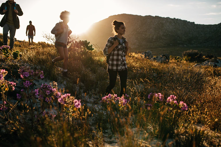 A group of people walking in countryside.