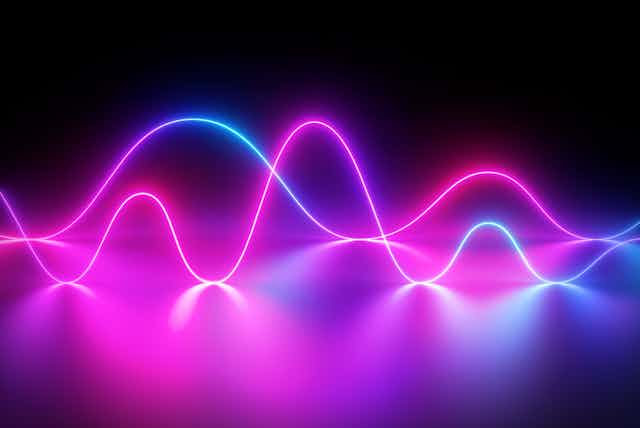 Wavy lines illuminated in purple and blue