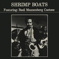 An album cover in black and white features a photo of a man playing the saxophone.