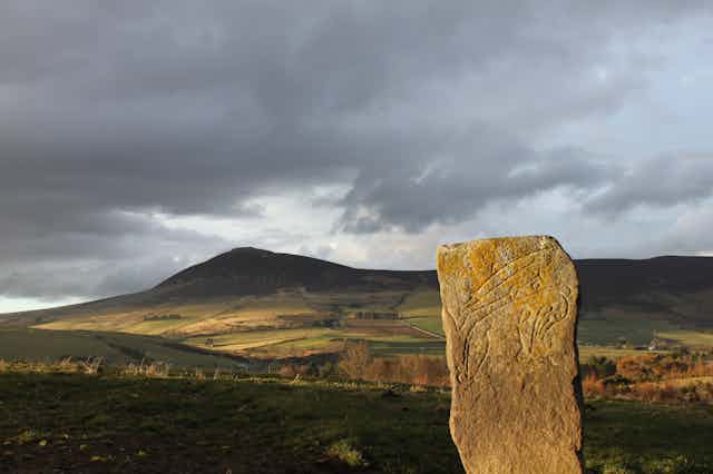The Craw Stane Symbol Stone (foreground) and Tap o’Noth hillfort (background). Two important Pictish sites in Northeast Scotland.