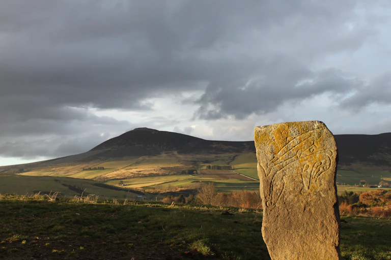The Craw Stane Symbol Stone (foreground) and Tap o’Noth hillfort (background). Two important Pictish sites in Northeast Scotland.