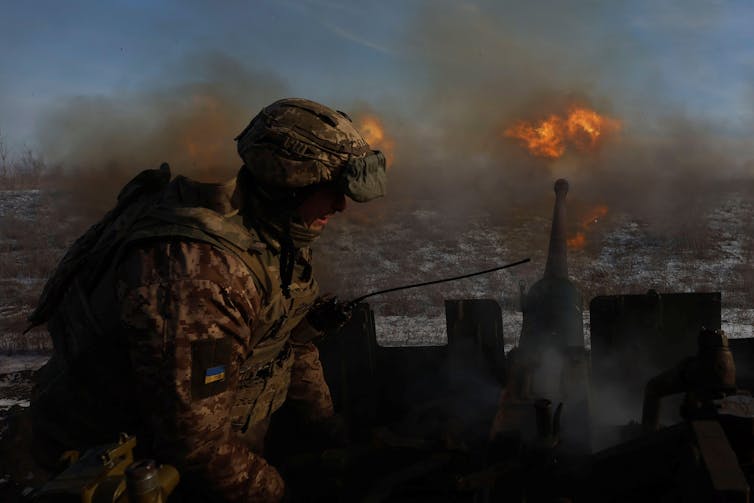 A soldier returning fire in Bakhmut, Ukraine.