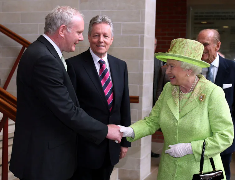 Martin McGuinness shaking hands with Queen Elizabeth II.
