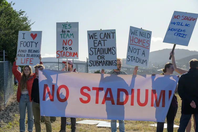 Locals protest the proposed stadium during Anthony Albanese' press conference in Hobart on Saturday April 29, 2023 to announce $240 million for the harbourside development.