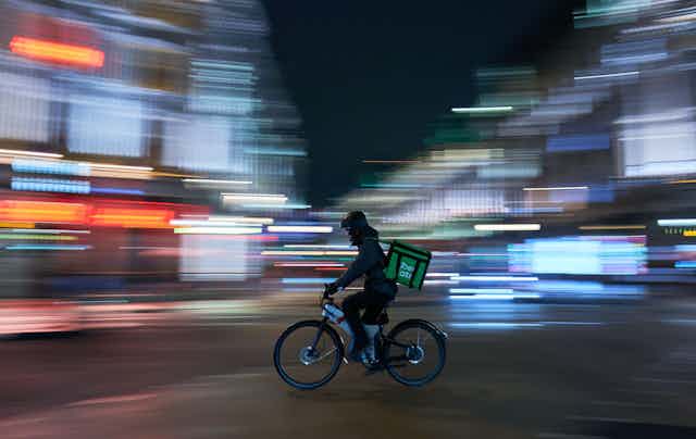 Food cycle courier in city street