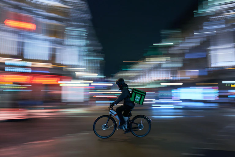 Food cycle courier in city street