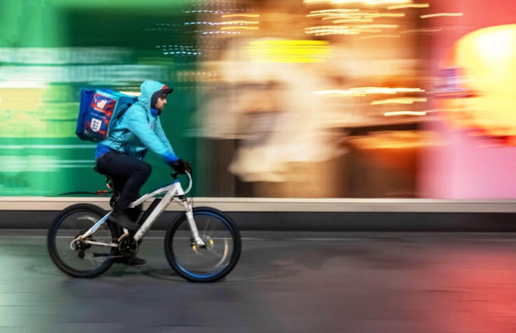 Food courier in city street