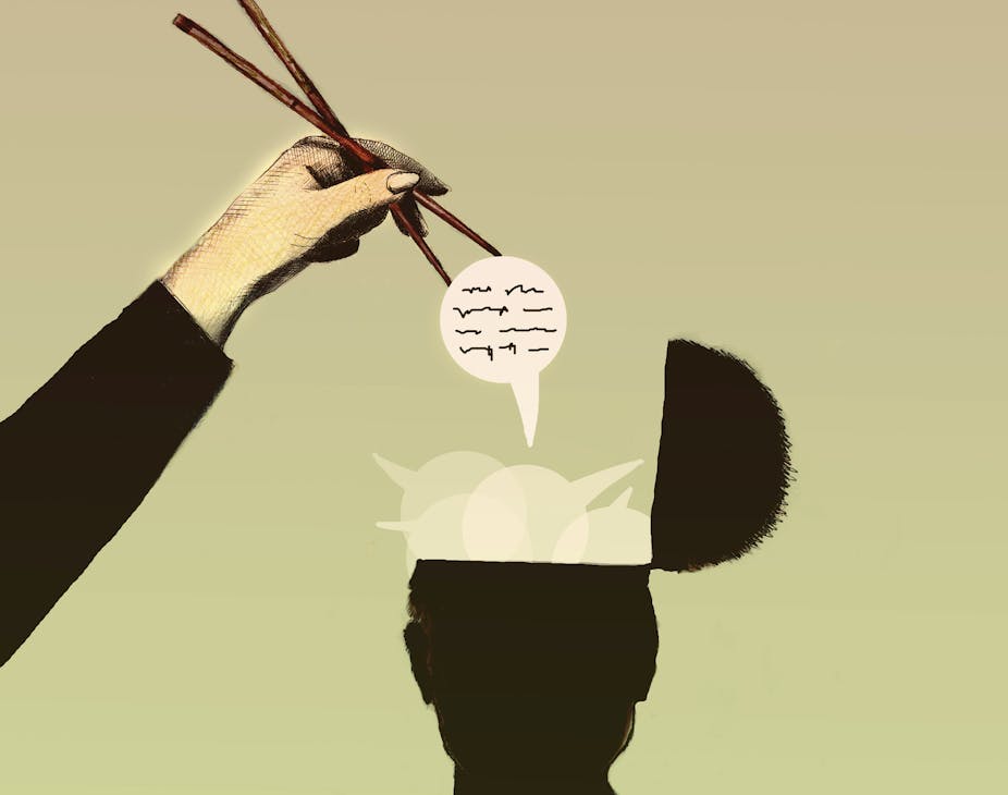 Hand uses chopsticks to extract thought bubble from man's head.