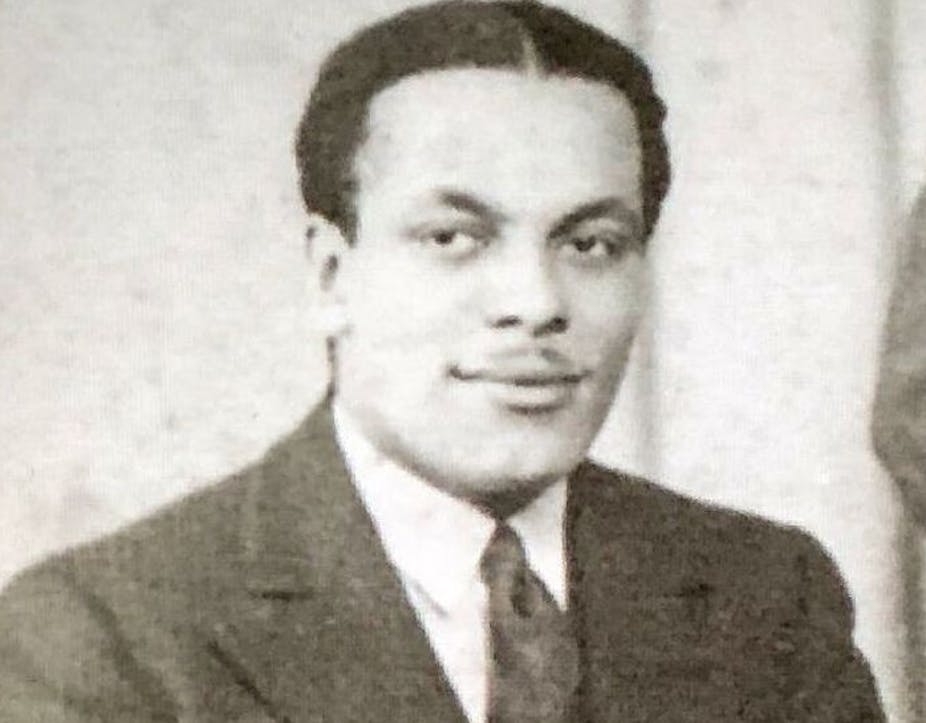 A portrait of Ivor Cummings wearing a suit.