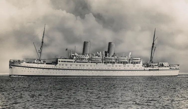 The large Empire Windrush ship pictured at sea