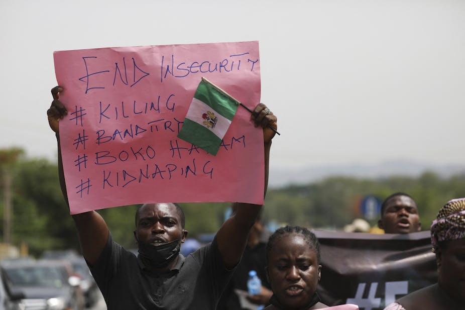 Man holding a placard during a mass protest