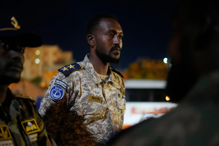A Sudanese military officer watches evacuation operations in Port Sudan, May 2023