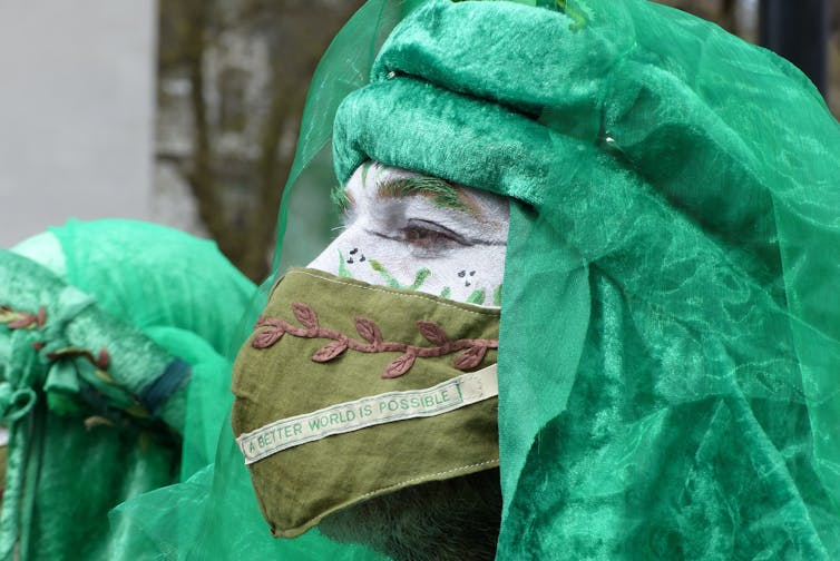 Person in green costume