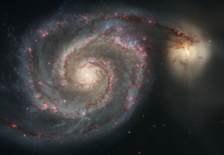 The Whirlpool Galaxy, known as M51, and a companion galaxy.