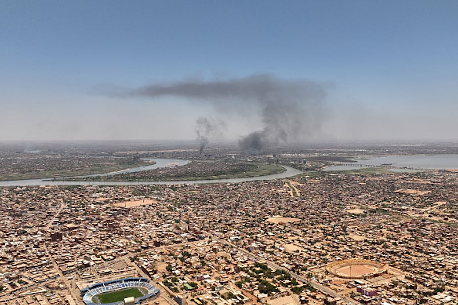 Photo of an aerial view of smoke billowing out of Khartoum's military showdown