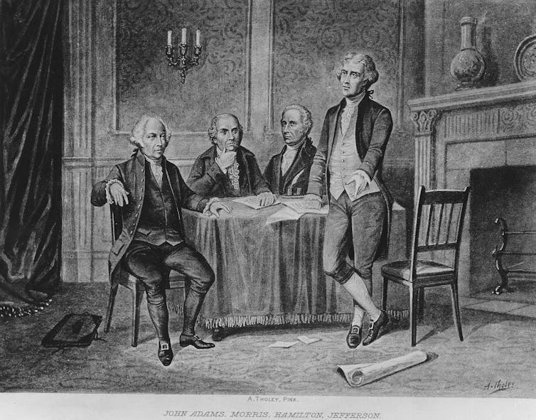 A black and white drawing shows four men with old fashioned clothing sitting around a table. One of them stands next to the table.