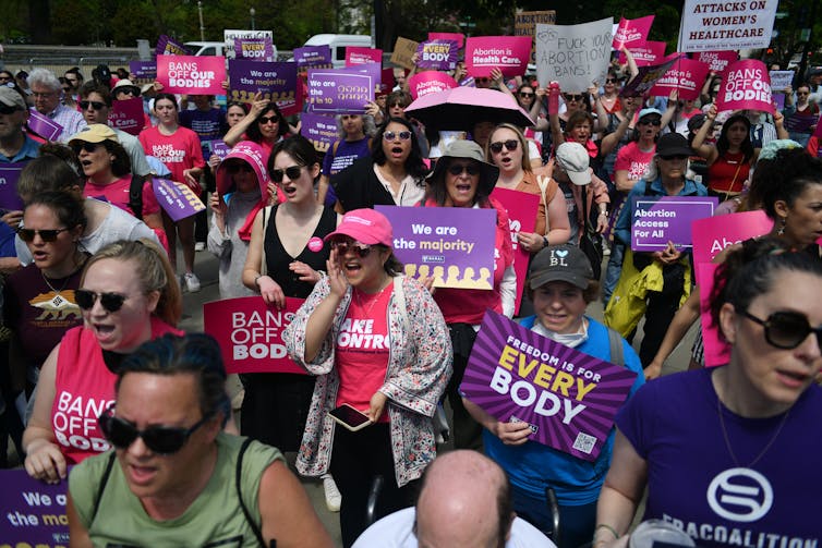 A group of women in a protest crowd.