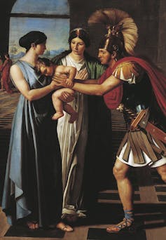A painting shows a man in formal battle wear handing off a naked infant to a woman in a blue tunic.