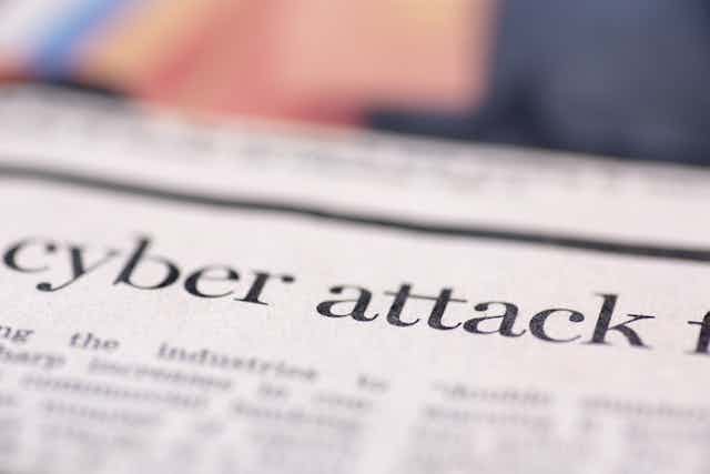 Newspaper with the words 'cyber attack'