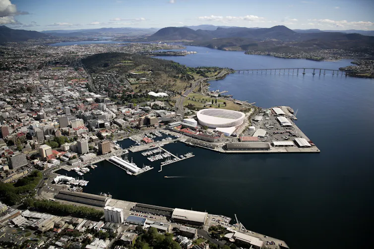 Artist's impression of a football stadium on a waterside point at the edge of the city