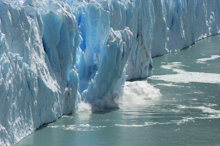 Antarctic ice melting and crashing into the sea