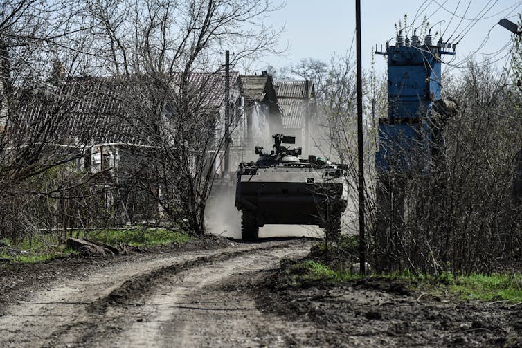 A Ukrainian forces' M113 APC drives through the countryside near Bakhmut in eastern Ukraine.