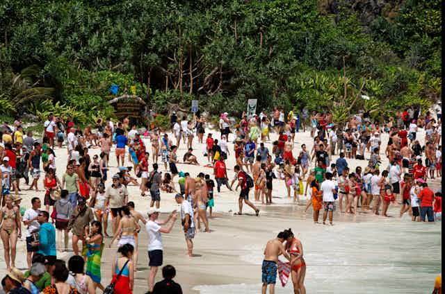 Crowds of tourists at Maya Bay, Thailand.