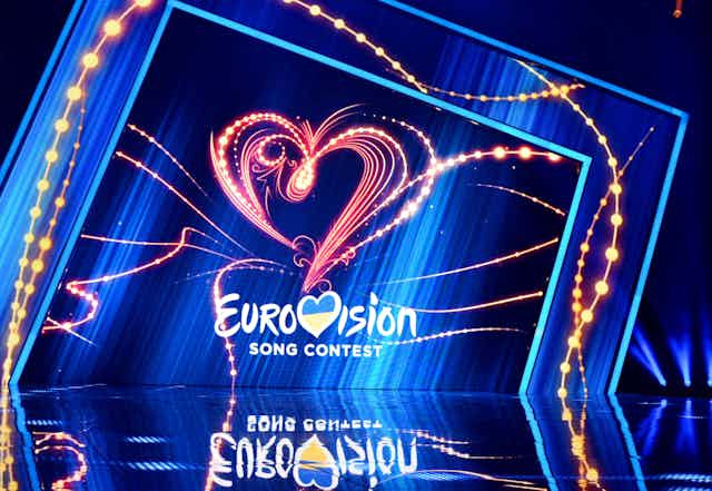 An empty stage with the Eurovision logo in the background