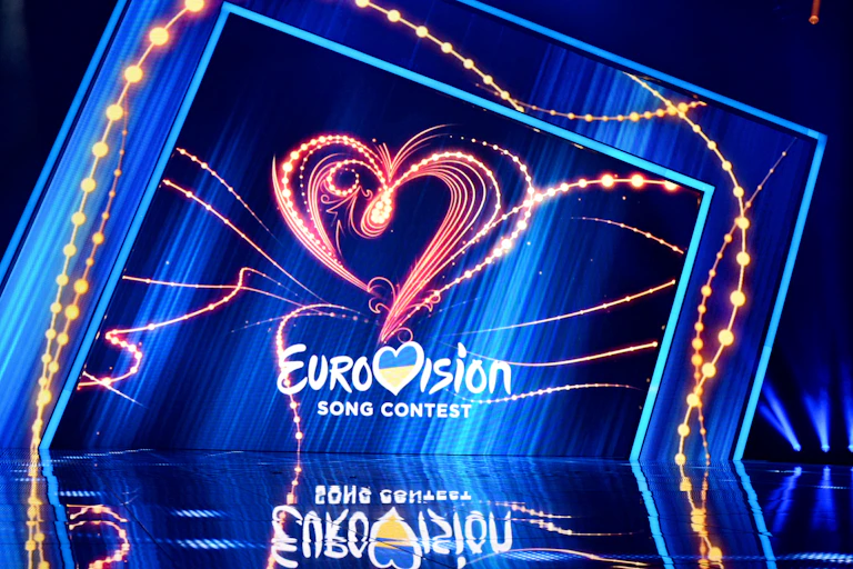 An empty stage with the Eurovision logo in the background