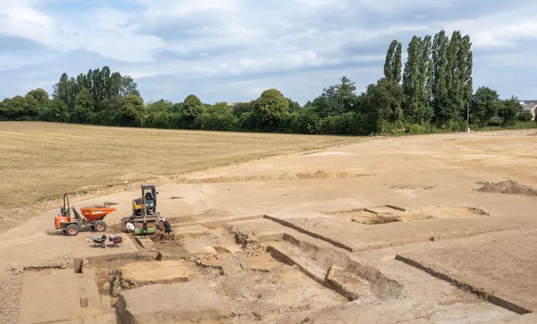 A digger working on the temple excavation.