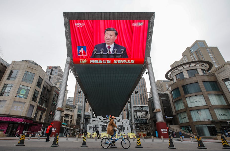 A big screen broadcast of Xi.