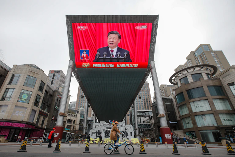 A big screen broadcast of Xi.