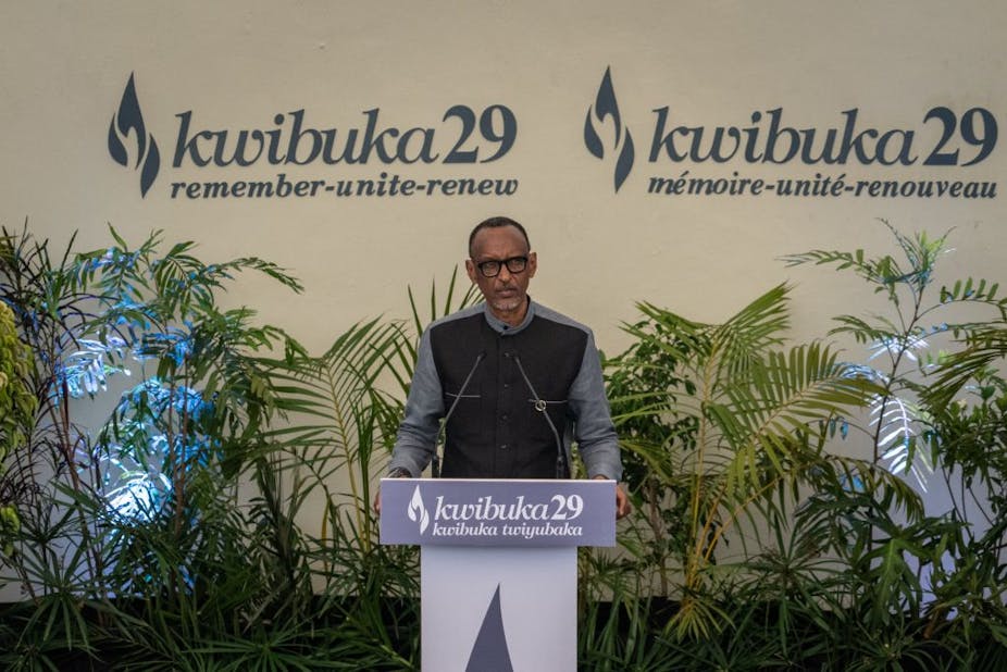 A man speaking at a podium with the words 'Kwibuka29 remember unite renew' written behind him