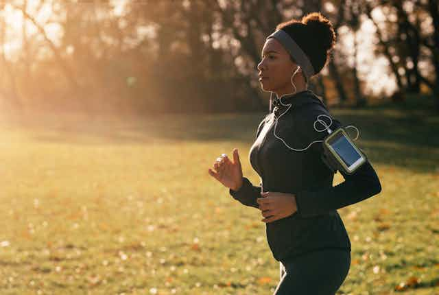 woman runs in park