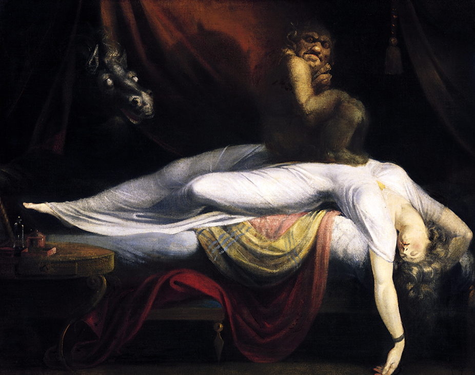 A woman lying asleep with a demon sitting on her chest and a horse's head poking through a curtain behind. 