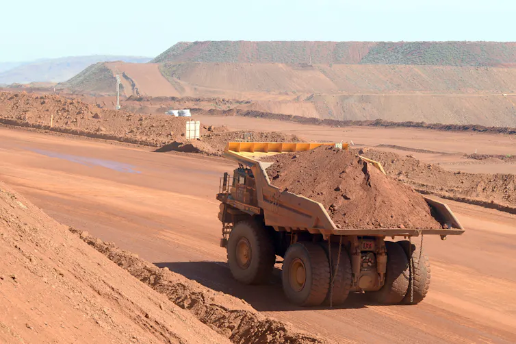truck carries red dirt