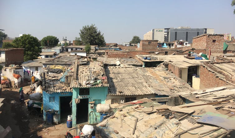 View of roofs in Ramapir No Tekro showing high-density, low-rise construction.