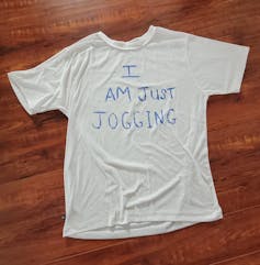 A T-shirt reads I am just jogging.