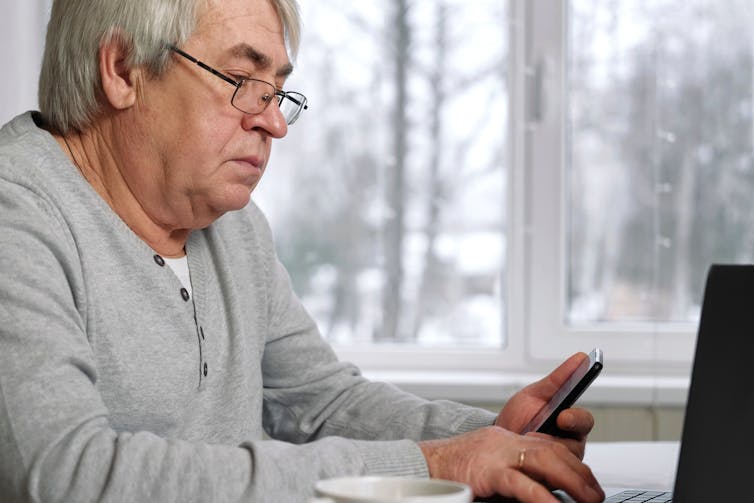 Man looks at phone