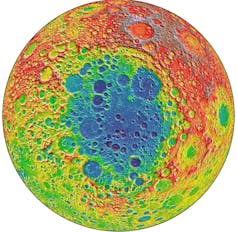 A rainbow coloured image of a textured circle with red around the edges and blue in the middle