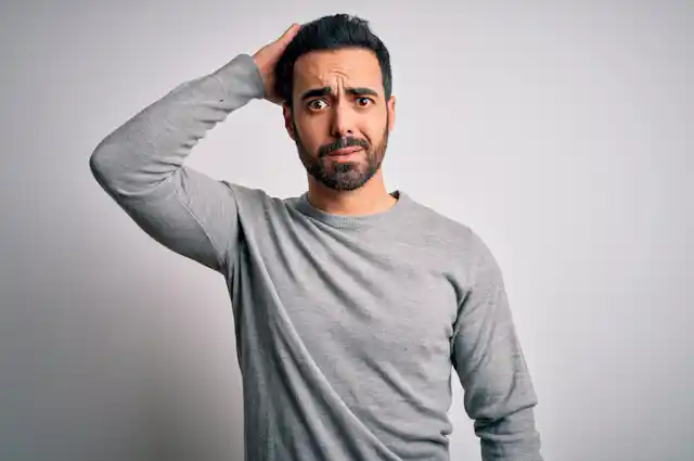 Young man with perplexed expression
