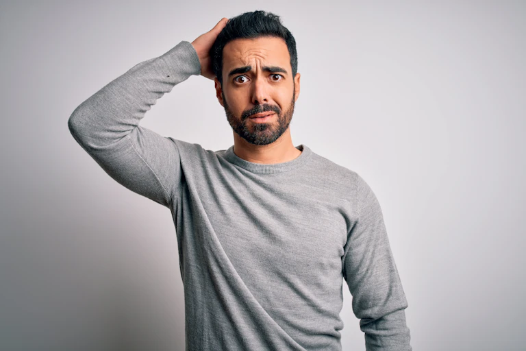 Young man with perplexed expression