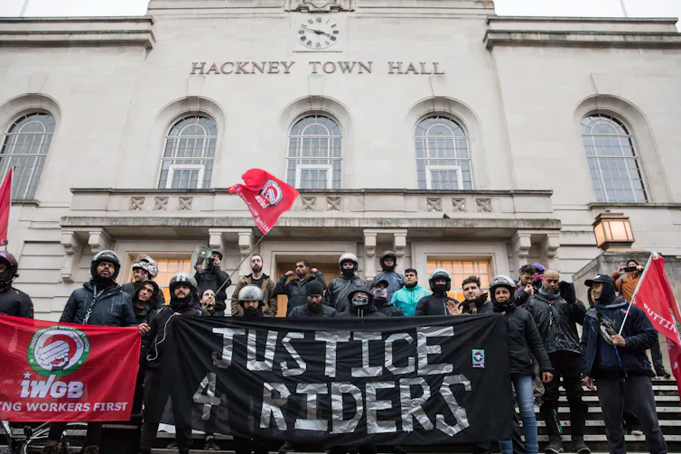 Protesters with a banner outside town hall